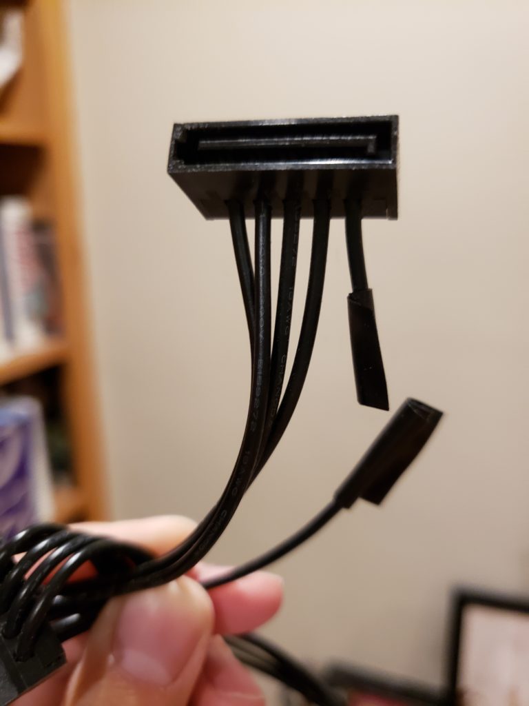 Cut the 3.3v wire on the SATA extender. It's the one closest to the small part of the "L"